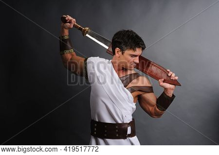 The Sexy Medieval Soldier Poses For The Photo.