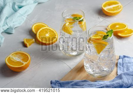 Hard Seltzer Cocktail With Orange, Mint And Ice.