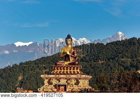 Statue Of Buddha At The Buddha Park With Blue Sky And Clouds In The Background As Seen From Rabongla