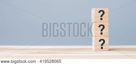 Questions Mark ( ? ) On Wooden Cube Block On Table Background. Faq( Frequency Asked Questions), Answ