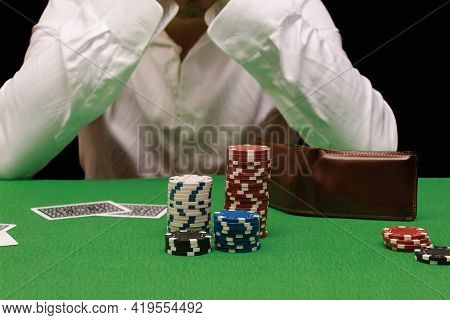 Unfortunate Young Man Feeling Sad, Desperate And Stressed After Losing His Money Playing Poker And B