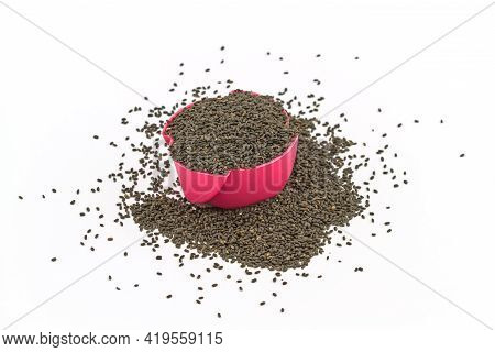 Sweet Basil Seeds ,ocimum Canum Sims In Pink Paper Cup On White Background