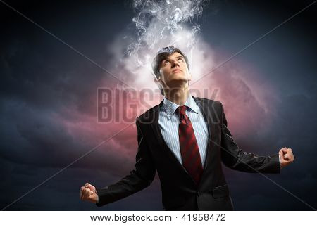 businessman in anger with fists clenched and steam above head