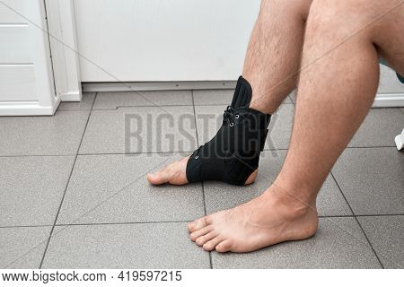 The Male Leg Is Fixed In A Medical Bandage. Ankle Fracture Or Sprain. Lacing And Tight Fit Of The Fo