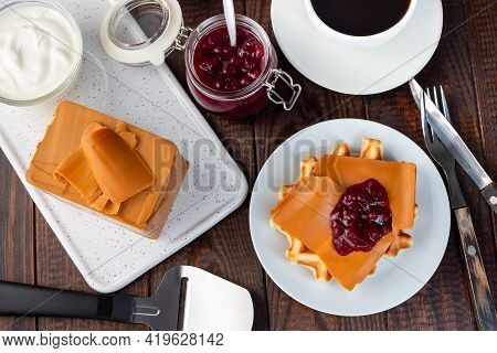 Homemade Waffles With Norwegian Brown Cheese And Lingon Jam, On A Wooden Background, Horizontal, Top