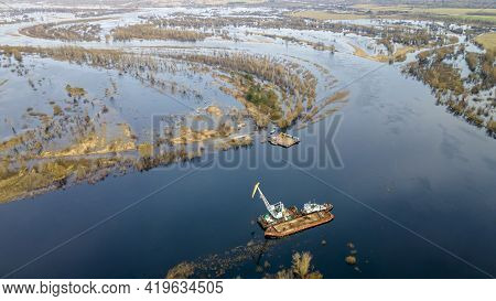 Dredger Is Working To Deepen The Fairway On The River. Cleaning And Deepening By A Dredger On The Ri