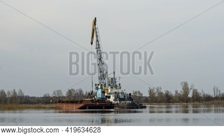 Dredger Is Working To Deepen The Fairway On The River. Cleaning And Deepening By A Dredger On The Ri
