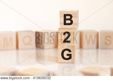 Word B2G From Wooden Blocks With Letters, Concept