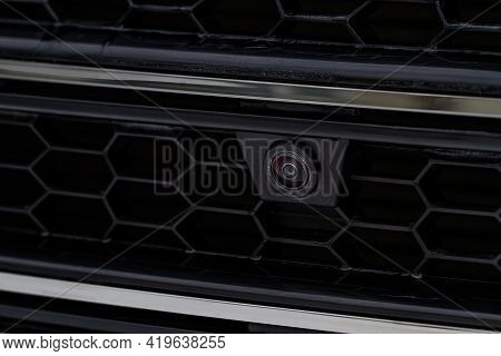 Close Up View Of Front Parking Assist Video Camera On The Car. Front View Cameara Of Modern Car.