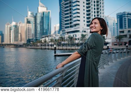 Happy Young Female Traveler In The Big City Of Dubai, Uae