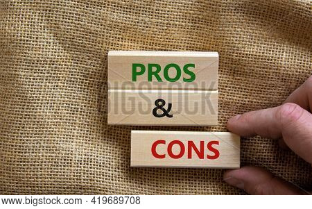 Pros And Cons Symbol. Wooden Blocks With Words 'pros And Cons'. Beautiful Canvas Background, Busines