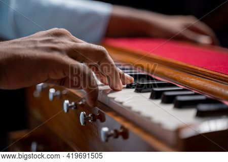 Close Up Of Hands Playing Harmonium Or Reed Organ An Indian Classical Music Instrument