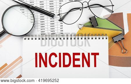 Text Incident On White Paper Notebook On The Diagram. Business
