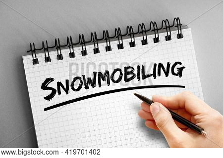 Snowmobiling - Text On Notepad, Concept Background