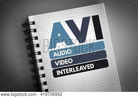 Avi - Audio Video Interleaved Acronym On Notepad, Technology Concept Background
