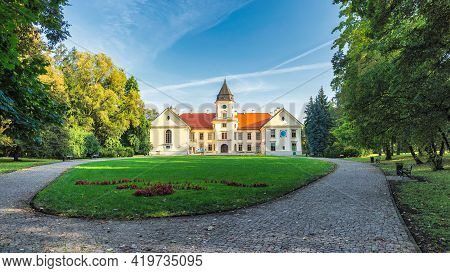 Wide-angle Shot Of Renovated 15th-century Castle (front View) With The Park Complex And Gardens, Loc