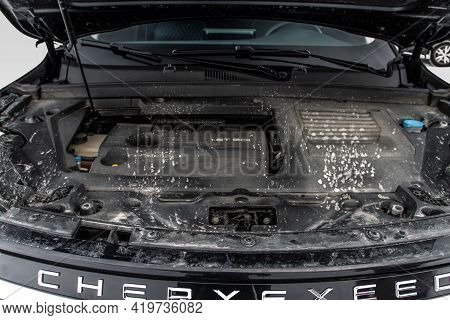 Moscow, Russia - February 23, 2021 Cheryexeed Txl Suv Close Up Engine View With Opened Car Bonnet.  