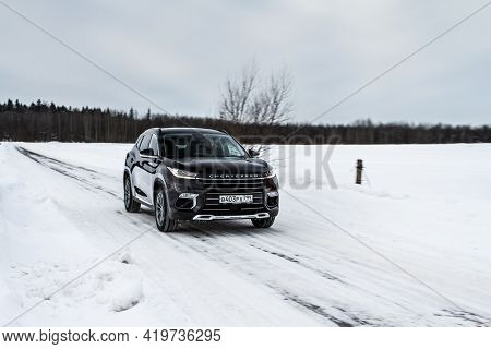 Moscow, Russia - February 23, 2021 Cheryexeed Txl Suv Car In Motion Front Side View. Black Suv On Na