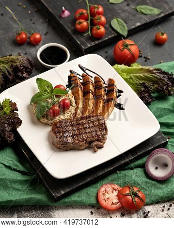 Juicy Grilled Meat Steak With Vegetables. Delicious Tender Meat Medallion Fried On Wire Rack. Exquis