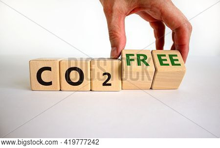 Co2 Free Symbol. Businessman Turns Cubes, Changes Concept Words 'co2' To 'co2 Free'. Beautiful White