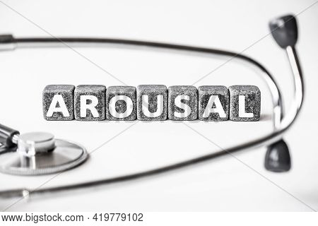 Stone Block Form Word Arousal With Stethoscope. White Background. Medical Concept. State Of Being Aw