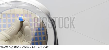 Silicon Wafer With Microchips, Fixed In A Holder With A Steel Frame On A Gray Background After The P