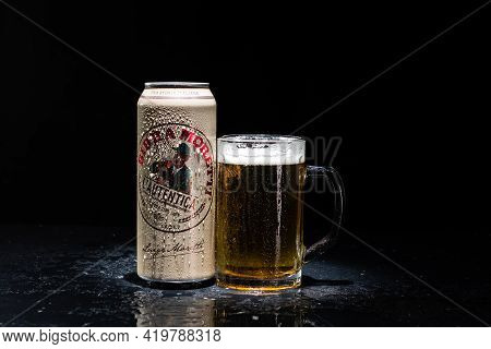 Can Of Birra Morreti Beer And Beer Glass On Dark Background. Illustrative Editorial Photo Shot In Bu