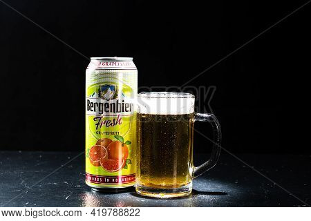 Can Of Bergenbier Beer And Beer Glass On Dark Background. Illustrative Editorial Photo Shot In Bucha