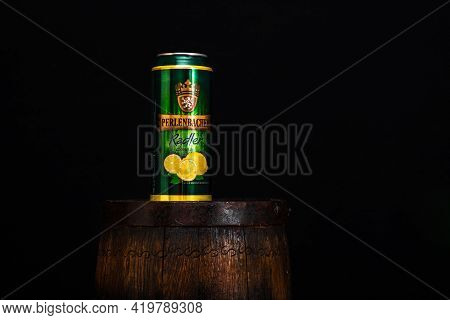 Can Of Perlenbacher Radler Beer On Beer Barrel With Dark Background. Illustrative Editorial Photo Sh