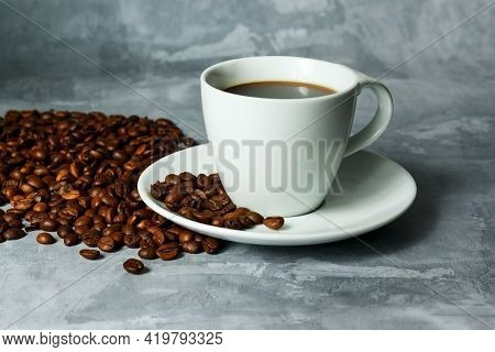 Hot Black Coffee For Morning Beverage Menu In White Ceramic Cup With Coffee Beans.