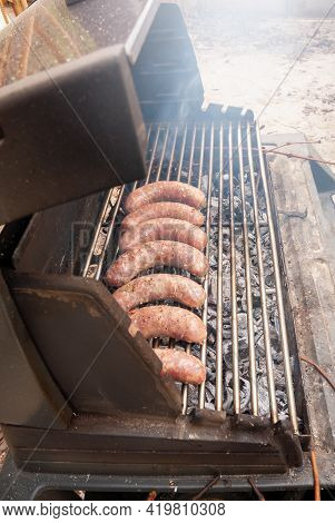 Delicious Grilled Sousages. Barbiquing Sousages On Hot Grill.