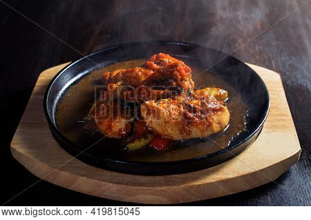 Fajitos, Meat In A Frying Pan With Fire On A Wooden Tray, Beautiful Serving, Dark Background.