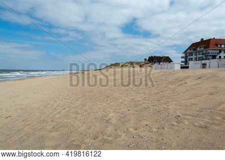Yellow Sandy Beach In Small Belgian Town Knokke-heist, Luxury Vacation Destination, Summer Holidays