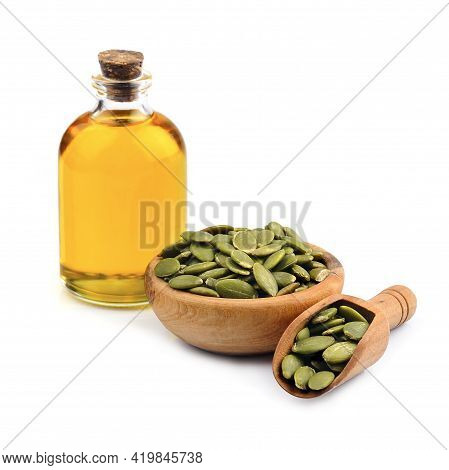 Pumpkin Seed And Pumpkin Oil On White Backgrounds. Healthy Food Ingredient.