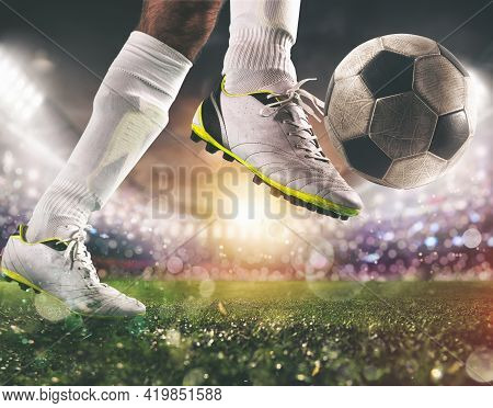 Close Up Of A Soccer Scene With Player In A White Uniform Kicking The Ball With Power
