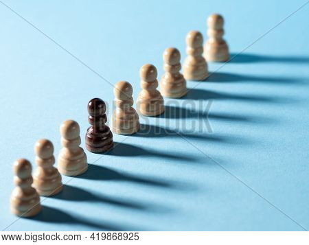 Chess Pieces In A Row, White Pawns On A Blue Background,
