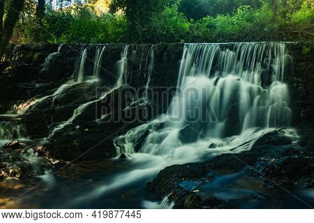 Waterfall Near The River Beach Of Mamoa