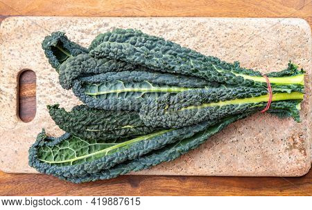 Cooking With Black Flat Leaves Of Cavolo Nero Tuscan Cabbage