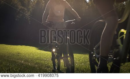 Two Girls On Mtb Bikes. Mother And Daughter Riding On A Forest Trail.