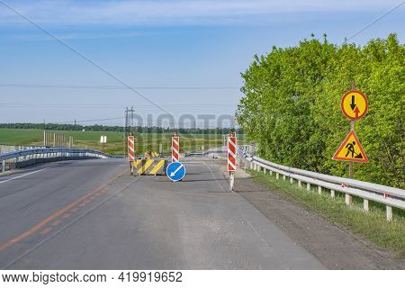 View Of The Road Blocked By Road Signs And Concrete Fences In The Bypass Of The Paved Highway, The R