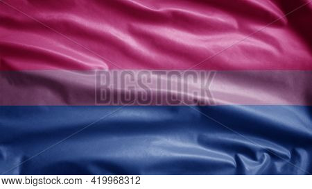 Bisexuality Flag Waving In The Wind. Close Up Of Bisexual Banner Blowing.