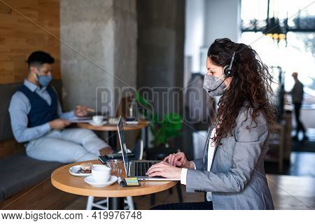 Business People With Laptop Working In Cafe, Small Business, Coronavirus And New Normal Concept.