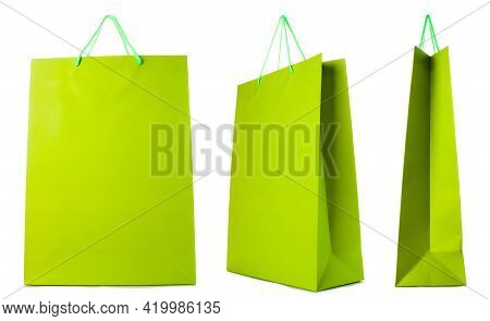 Green Paper Bag Isolated On White Background. Side, Front, Three-quarter View.