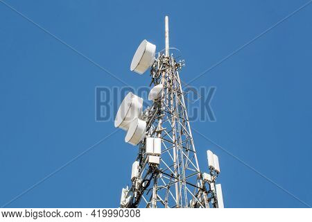 Radio, Communication And Cell Tower On Blue Sky Background
