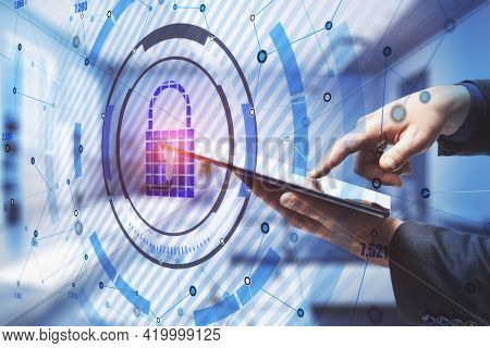 Black And Blue Keylock Hologram On A Background With A Hand Holding A Tablet, Data Safety And Securi