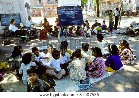 Teacher Teaches Children In The Outdoor Classroom