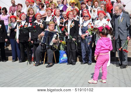 MOSCOW - MAY 9: Veterans sing near Bolshoi theater, on May 9, 2013 in Moscow, Russia.  Every year on square in front of Bolshoi Theater traditionally gather veterans of Great Patriotic War.