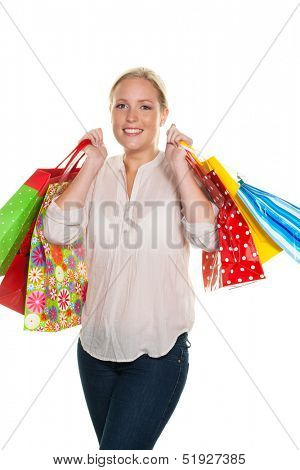 a young woman with colorful shopping bags while shopping. pleased with the bargain.