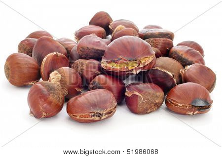 a pile of roasted chestnuts on a white background