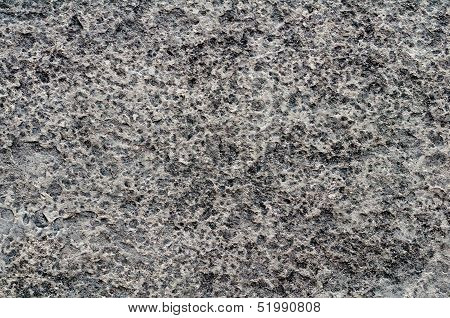Heavily Pitted Stone Surface